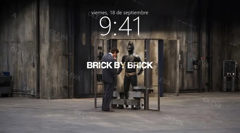 Póster vertical con la frase «Brick by brick»